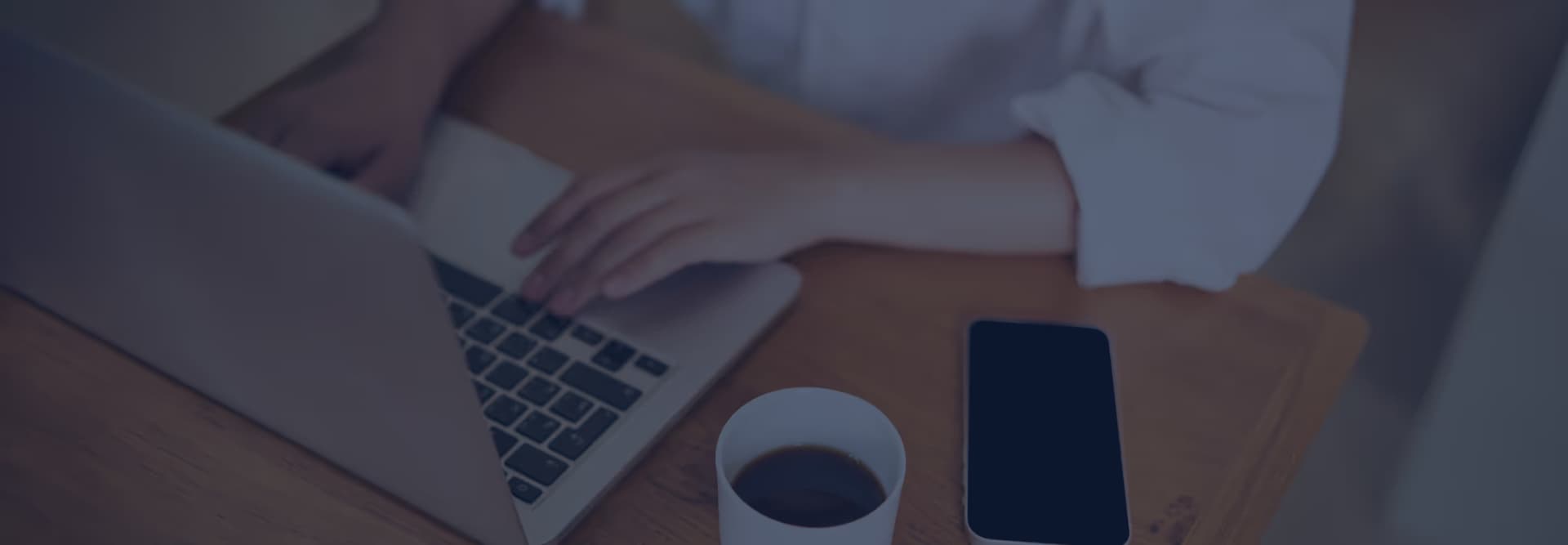 Person typing on laptop